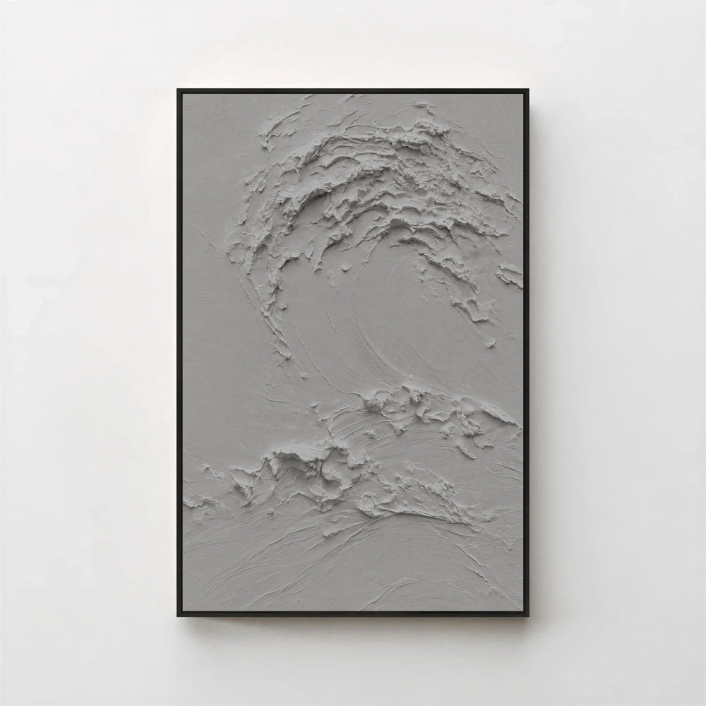 Creme No. 5 Graphite — grey textured wave canvas print in a black gallery frame on a pale wall