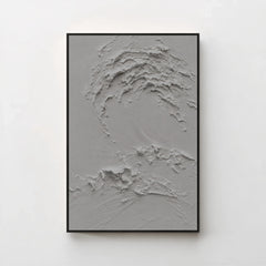 Creme No. 5 Graphite — grey textured wave canvas print in a black gallery frame on a pale wall
