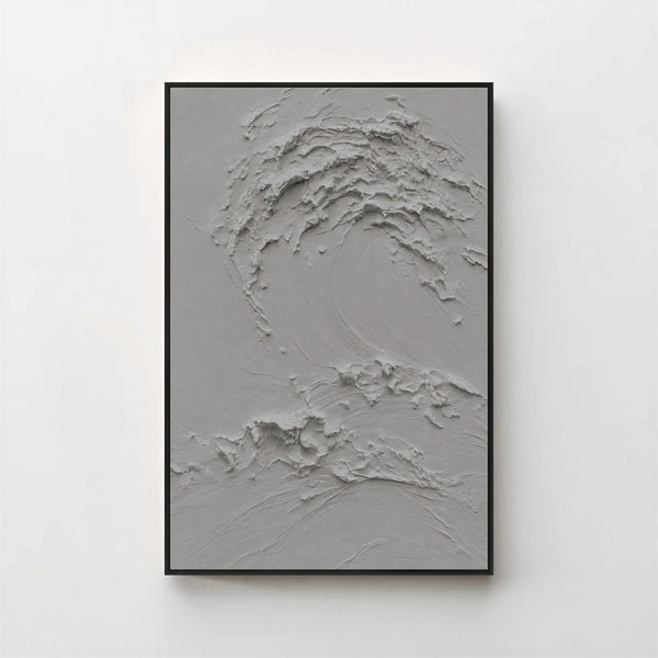 Creme No. 5 Graphite — grey textured wave canvas print in a black gallery frame on a pale wall