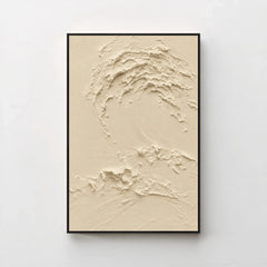 Creme No. 5 Greige — warm beige textured wave canvas print in a black gallery frame on a pale wall