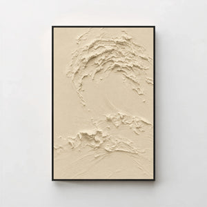Creme No. 5 Greige — warm beige textured wave canvas print in a black gallery frame on a pale wall