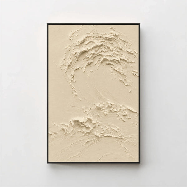 Creme No. 5 Greige — warm beige textured wave canvas print in a black gallery frame on a pale wall