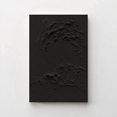 Creme No. 5 Noir — black textured wave canvas print in a black gallery frame on a pale wall