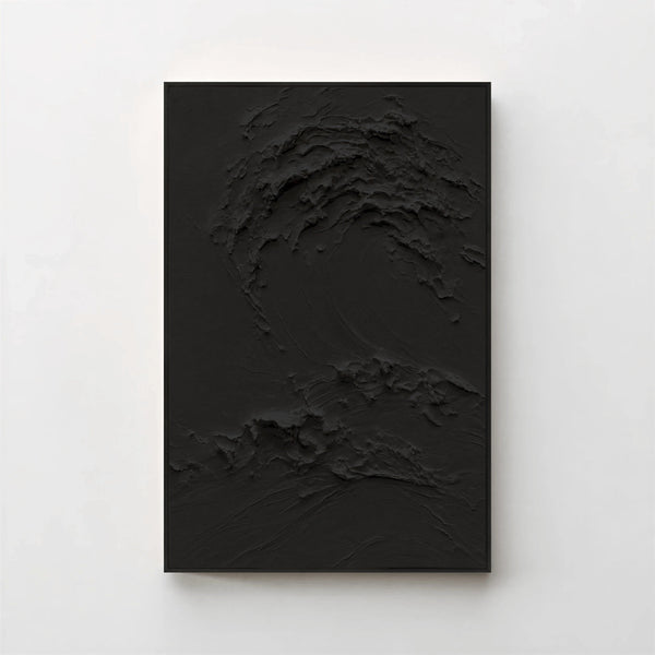 Creme No. 5 Noir — black textured wave canvas print in a black gallery frame on a pale wall