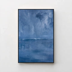 Harmonic Minimalism No. 27 Blue — deep blue seascape canvas print in a black gallery frame on a pale wall