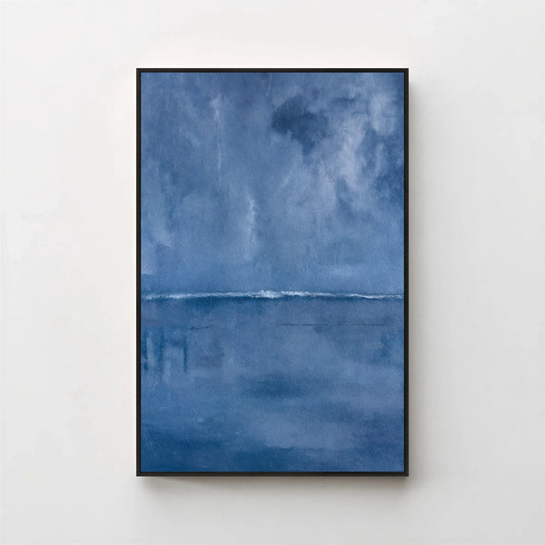 Harmonic Minimalism No. 27 Blue — deep blue seascape canvas print in a black gallery frame on a pale wall