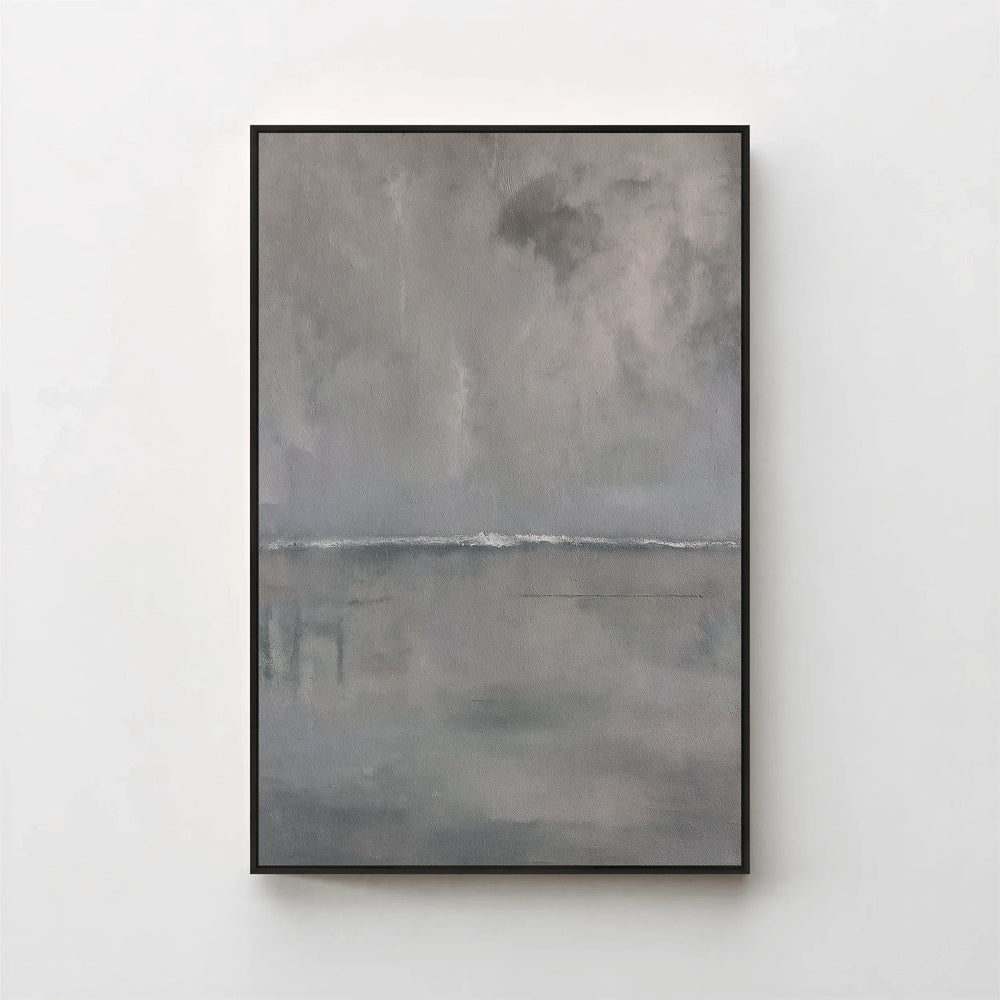 Harmonic Minimalism No. 27 Graphite — grey seascape canvas print in a black gallery frame on a pale wall