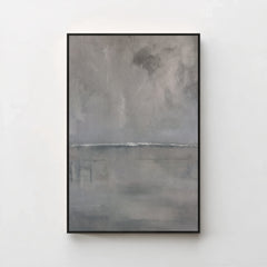 Harmonic Minimalism No. 27 Graphite — grey seascape canvas print in a black gallery frame on a pale wall