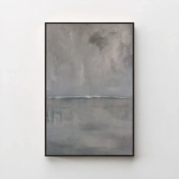 Harmonic Minimalism No. 27 Graphite — grey seascape canvas print in a black gallery frame on a pale wall