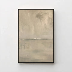 Harmonic Minimalism No. 27 Greige — warm greige seascape canvas print in a black gallery frame on a pale wall