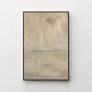 Harmonic Minimalism No. 27 Greige — warm greige seascape canvas print in a black gallery frame on a pale wall
