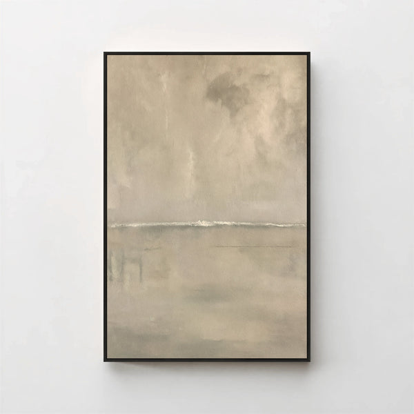 Harmonic Minimalism No. 27 Greige — warm greige seascape canvas print in a black gallery frame on a pale wall