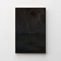 Harmonic Minimalism No. 27 Noir — dark seascape canvas print in a black gallery frame on a pale wall