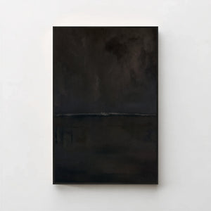 Harmonic Minimalism No. 27 Noir — dark seascape canvas print in a black gallery frame on a pale wall