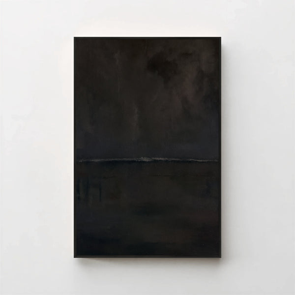 Harmonic Minimalism No. 27 Noir — dark seascape canvas print in a black gallery frame on a pale wall