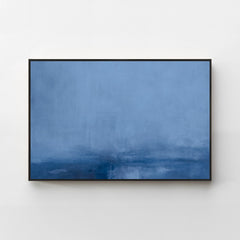 Harmonic Minimalism No. 31 Blue — deep blue horizontal landscape canvas print in a black gallery frame on a pale wall
