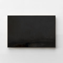 Harmonic Minimalism No. 31 Noir — dark horizontal landscape canvas print in a black gallery frame on a pale wall